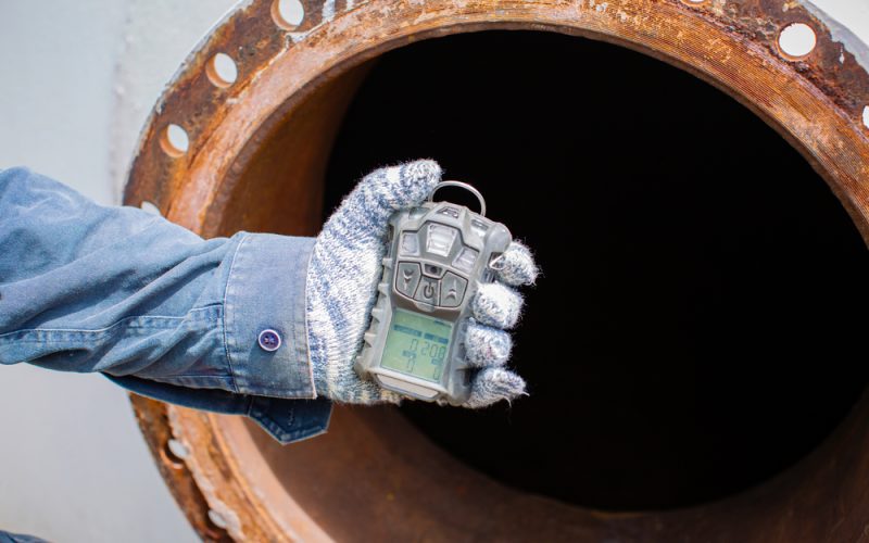 Worker,Hand,Holding,Gas,Detector,Inspection,Safety,Gas,Testing,At